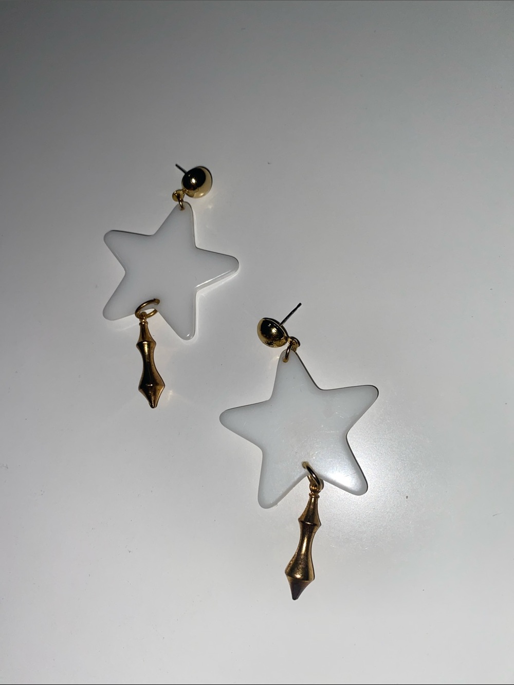 White Star Drop Earrings with Gold Tone Accents